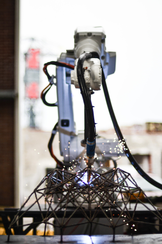 Illustration for article titled The Plan to 3D Print a Steel Bridge in Mid-Air